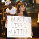 Demonstrators gather along West Florissant Avenue in Ferguson, Mo., Aug. 15, 2014, to protest the shooting death of Michael Brown.
Scott Olson/Getty Images